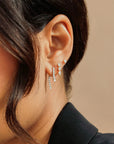Single Diamond Teardrop Fringe Earring on model in first hole