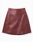 Burgundy leather skirt on a white background