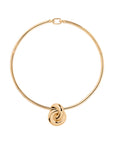 Gold necklace with a knot pendant on a white background