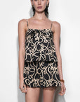 Woman wearing a matching set with patterns against a white background