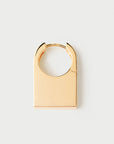 Gold hoop earring on a white background