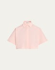A light pink short-sleeve button-up shirt with a pointed collar, presented flat against a solid off-white background.