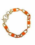 A gold-tone chain link bracelet with bright orange rectangular enamel inlays and a sparkling crystal-encrusted clasp, shown on a plain white background.