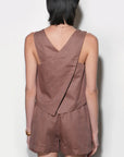 Brown sleeveless top and shorts outfit on a plain background