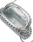 Silver clutch bag with chain strap open on a white background
