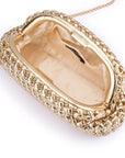Gold clutch bag with intricate design on a white background