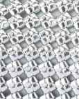Close-up of a metallic woven pattern