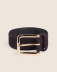 brown belt with a gold buckle on a cream background