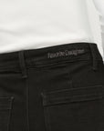 Black pants with 'Favorite Daughter' branding on a white background
