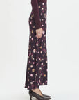 Floral patterned skirt worn by a person on a white background side view