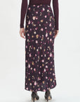 Floral patterned skirt worn by a person on a white background back view