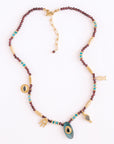 Necklace with beads and decorative elements on a white background