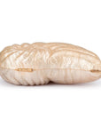 Shell-shaped clutch with gold accents on a white background bottom view with hinges