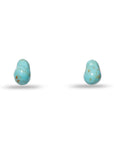 Two turquoise earrings with gold flecks on a white background