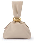 Beige fabric with a gold ring on a white background