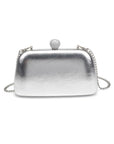 Silver clutch bag with a pearl clasp on a white background