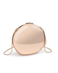 Gold spherical handbag on a white background