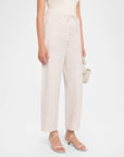 gingham print pants on a model with a white background