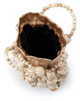 Decorative vase with shell-like design and dark interior on a white background