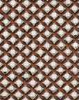 close up of clutch bag with a brown pattern and a metallic silver diamond mesh overlay