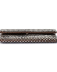 A rectangular clutch purse with an intricate metallic woven pattern, shown folded on a plain white background.