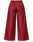 Red wide-leg cropped pants shown from the back, featuring two flap pockets and belt loops, on a plain white background.