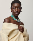 Toro Earrings in Aubergine on model with turquoise necklaces 