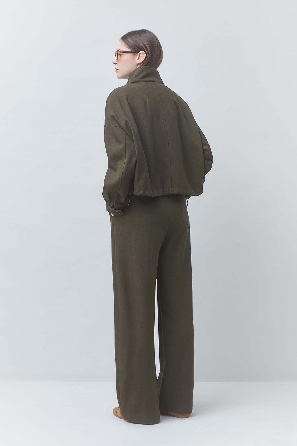 Dona Jacket full body back and partial side view on model
