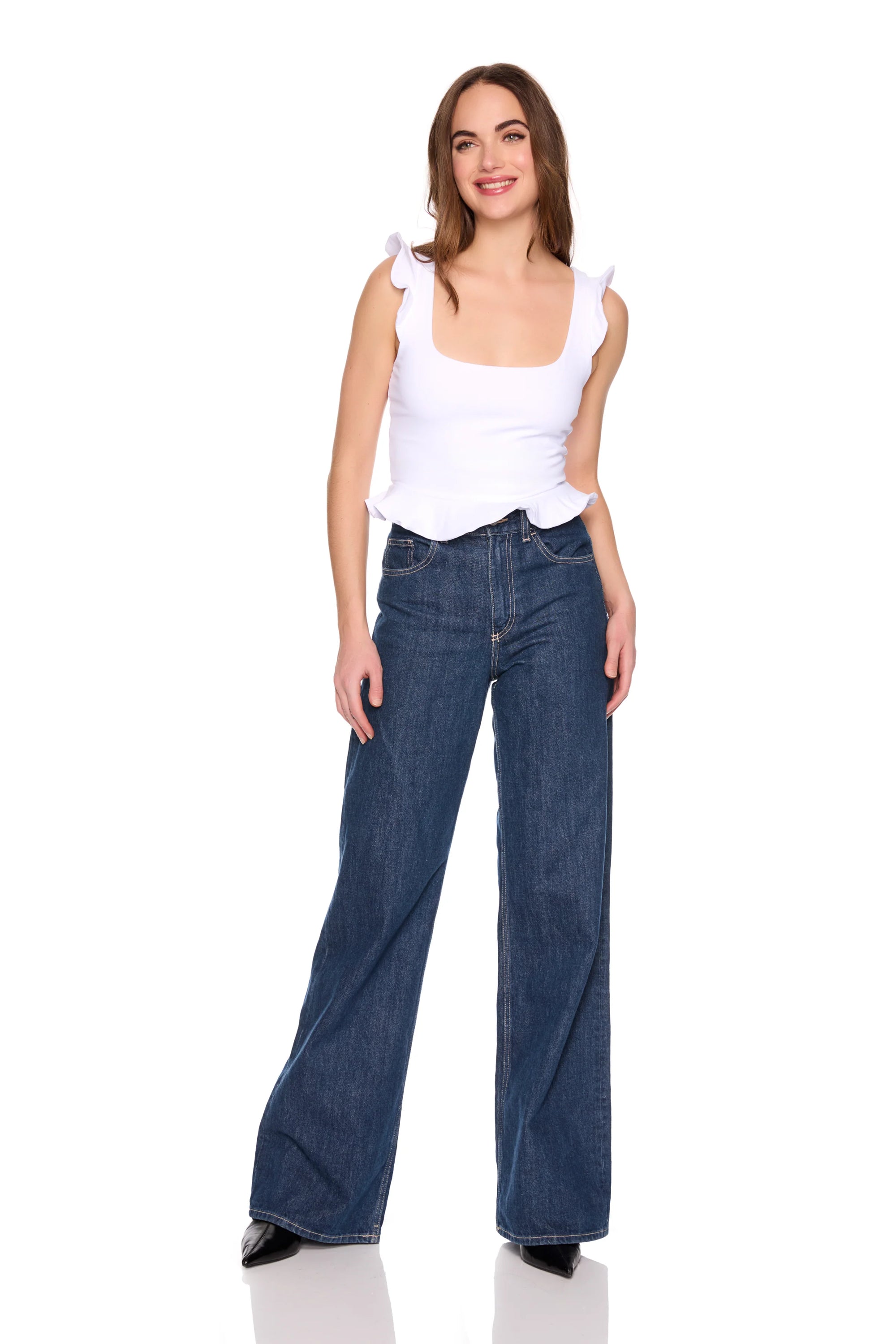 Woman wearing a white top and blue jeans on a white background, full body front