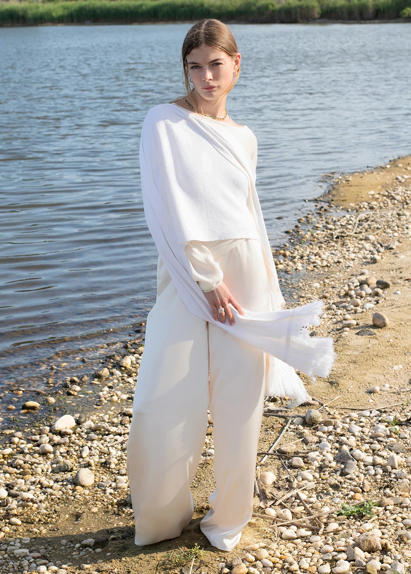 The Fringe Lightweight Knit Scarf draped on model