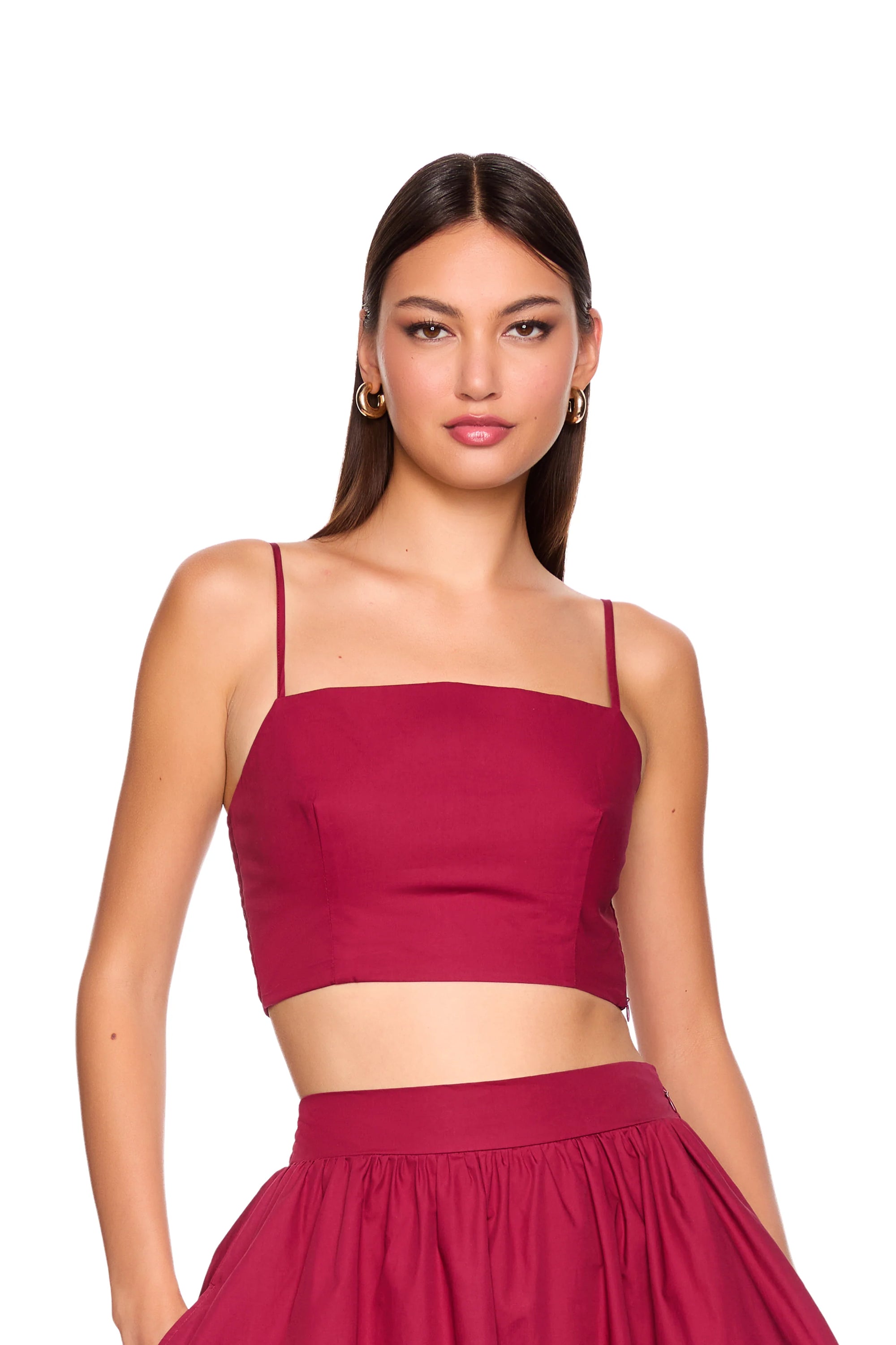 model wearing sleeveless top on white background