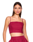 model wearing sleeveless top on white background