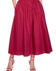 model wearing a midi skirt on a white background