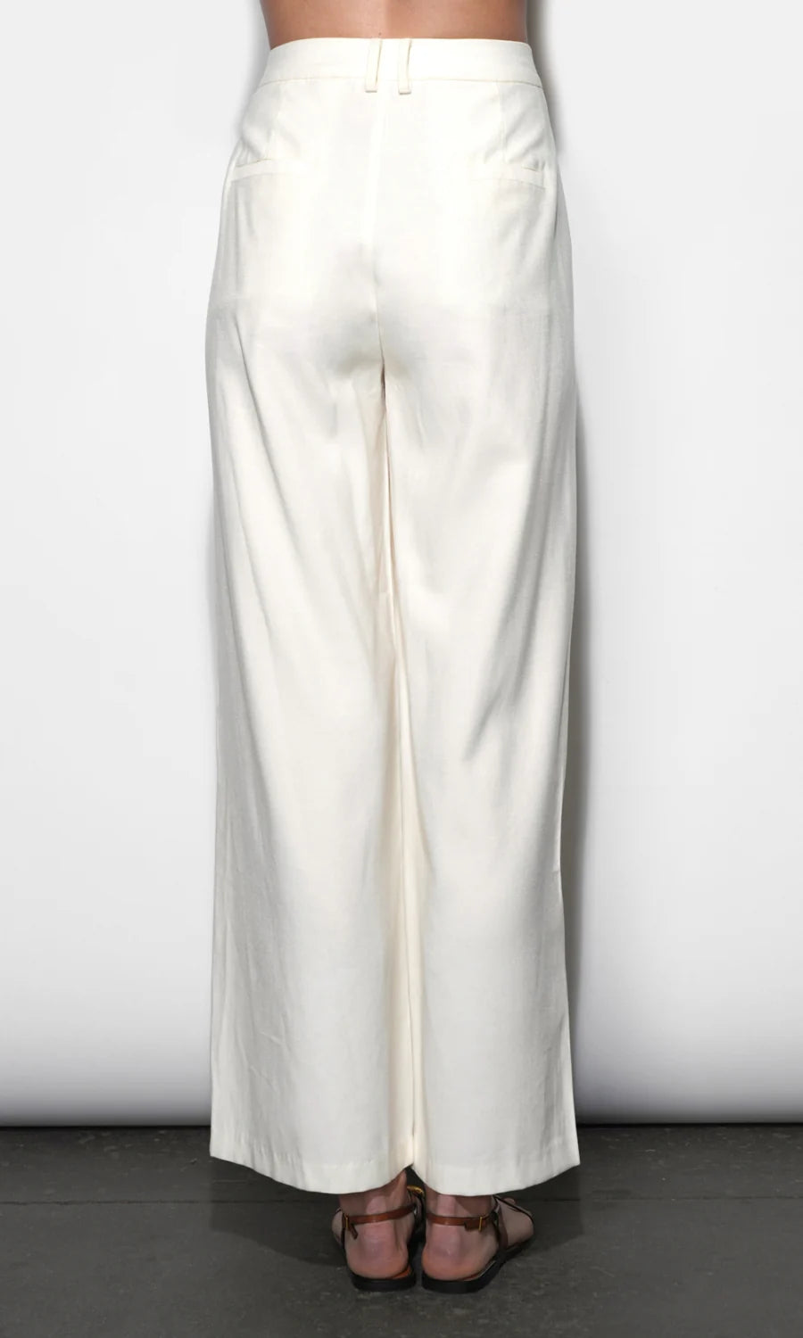 White wide-leg pants on a plain background