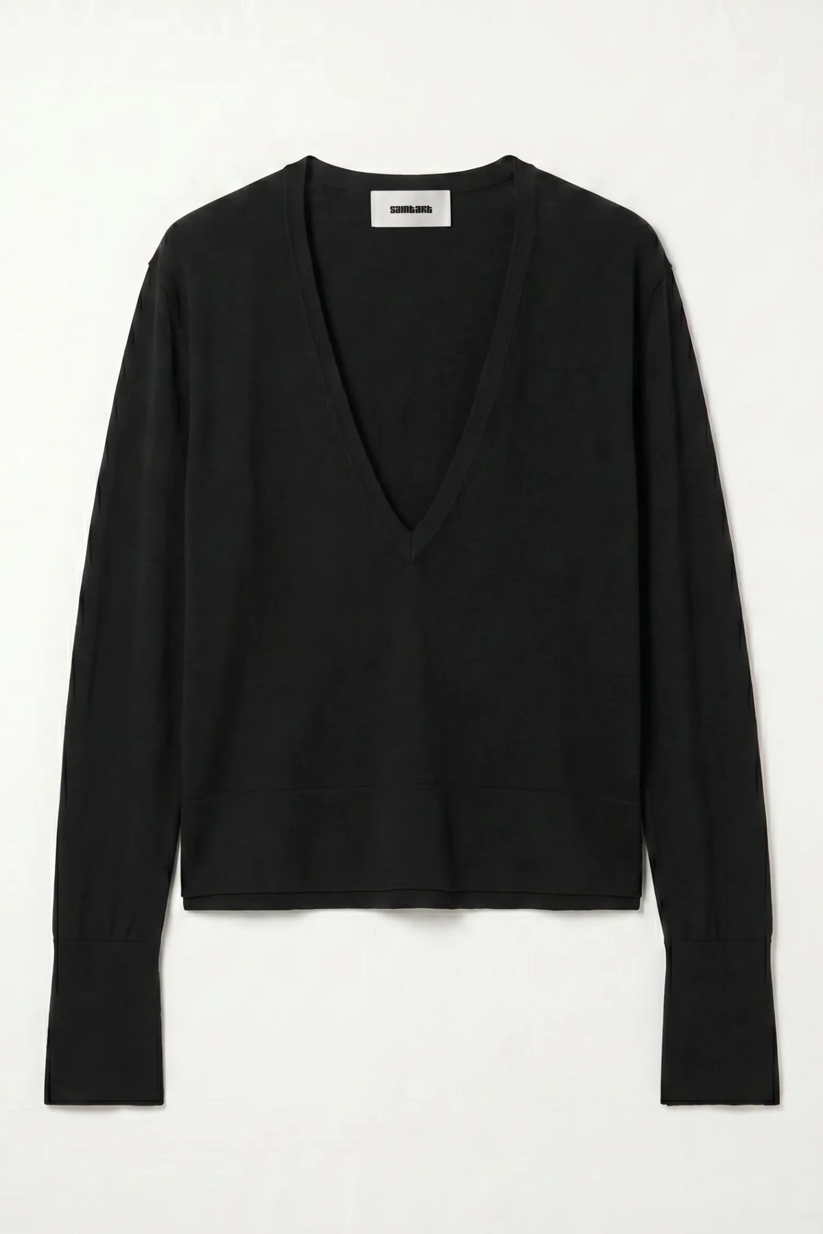 black v neck sweater flat on a grey background 
