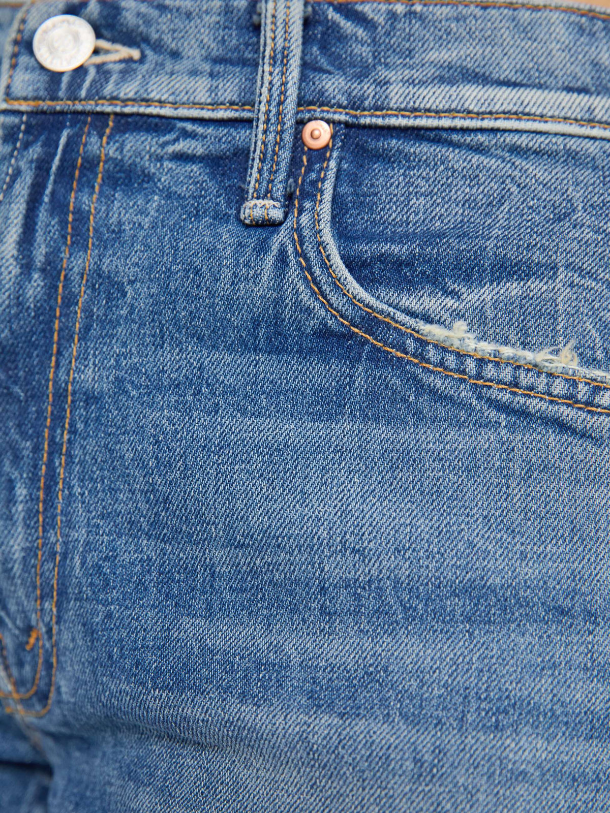 Close-up of blue denim jeans with stitching details