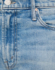 Close-up of blue denim fabric with stitching details