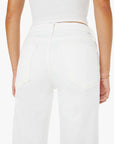 White pants worn by a person on a white background