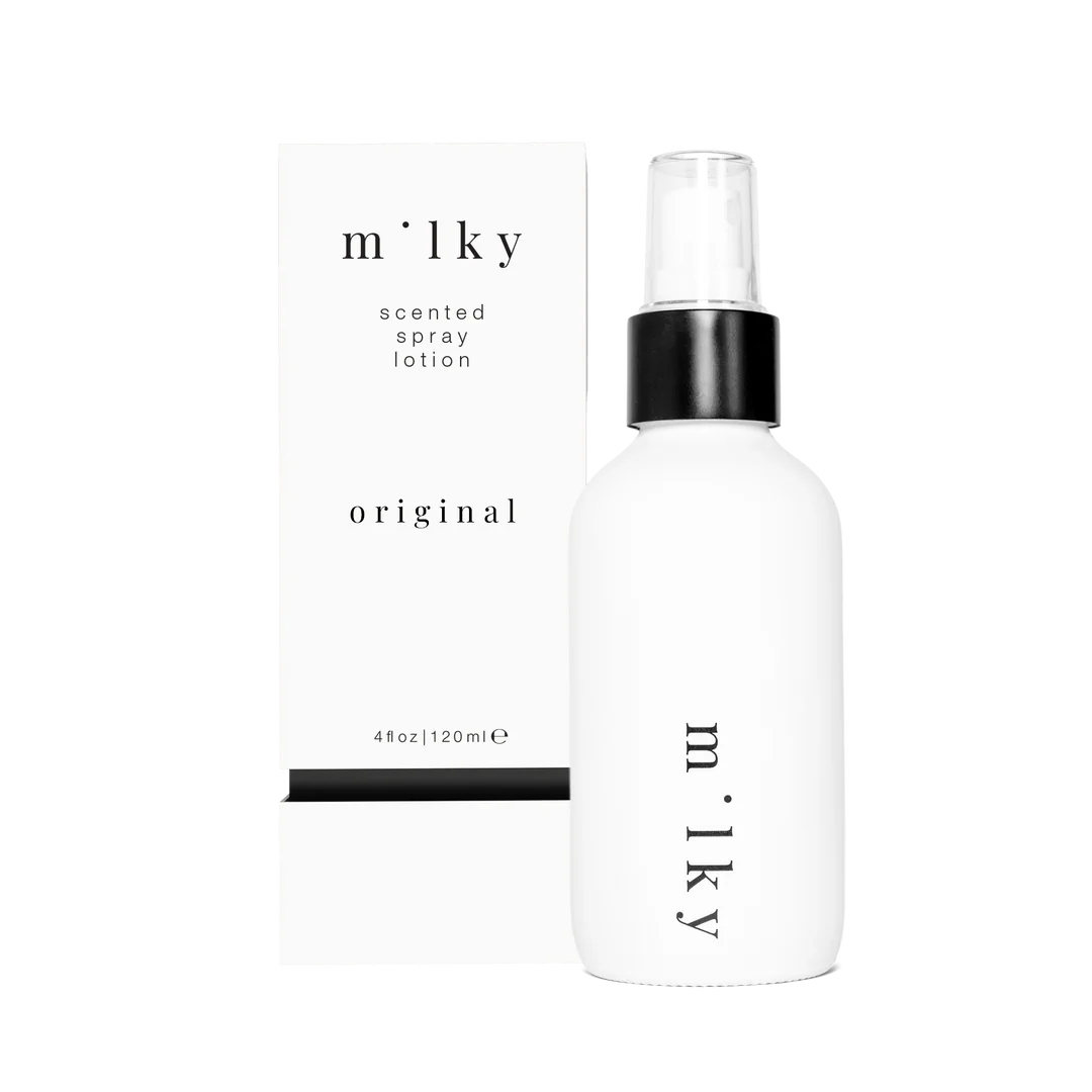 White spray bottle labeled 'milky' on a white background