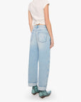 Person wearing a white t-shirt and light blue jeans on a white background