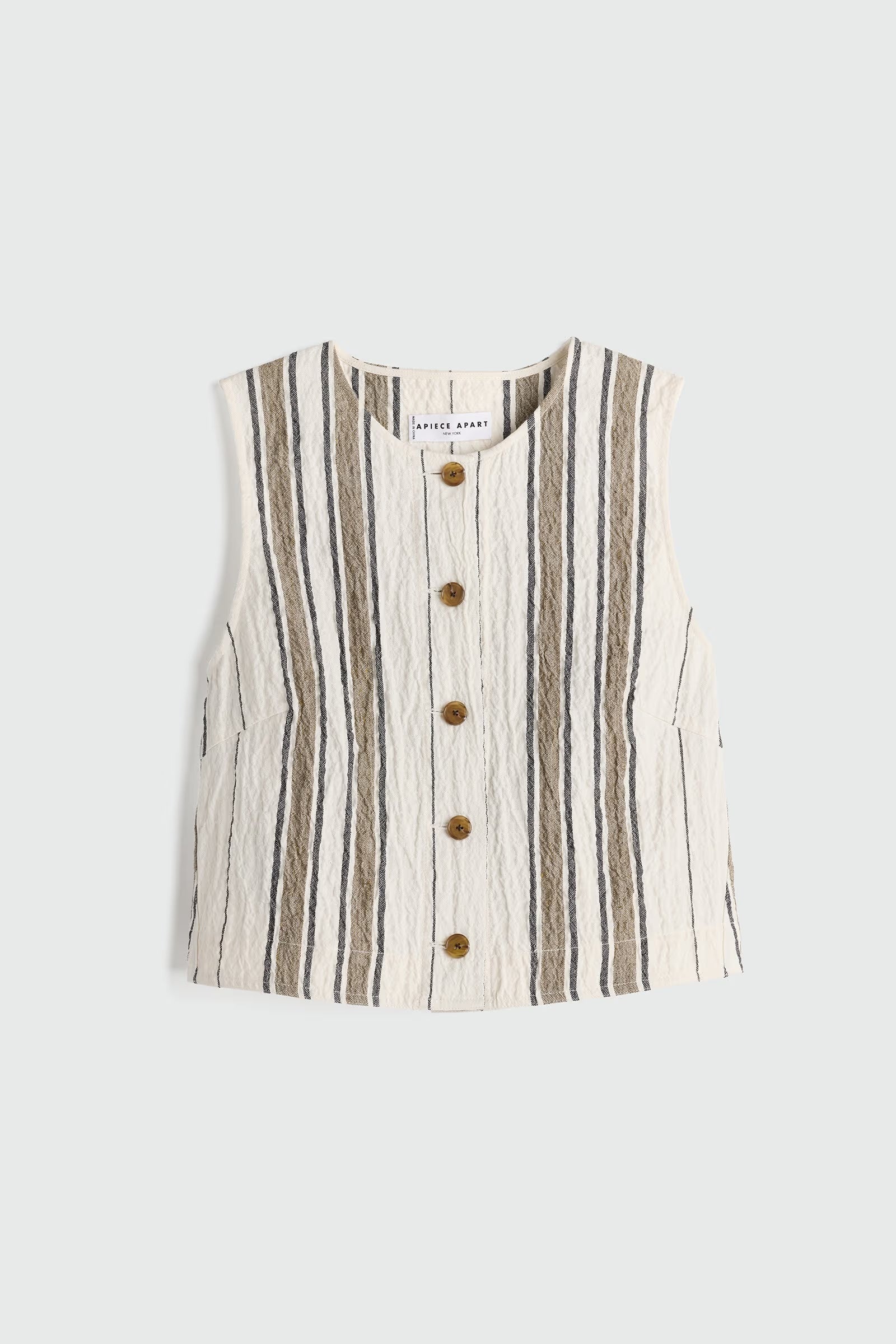 Striped sleeveless top with buttons on a light gray background