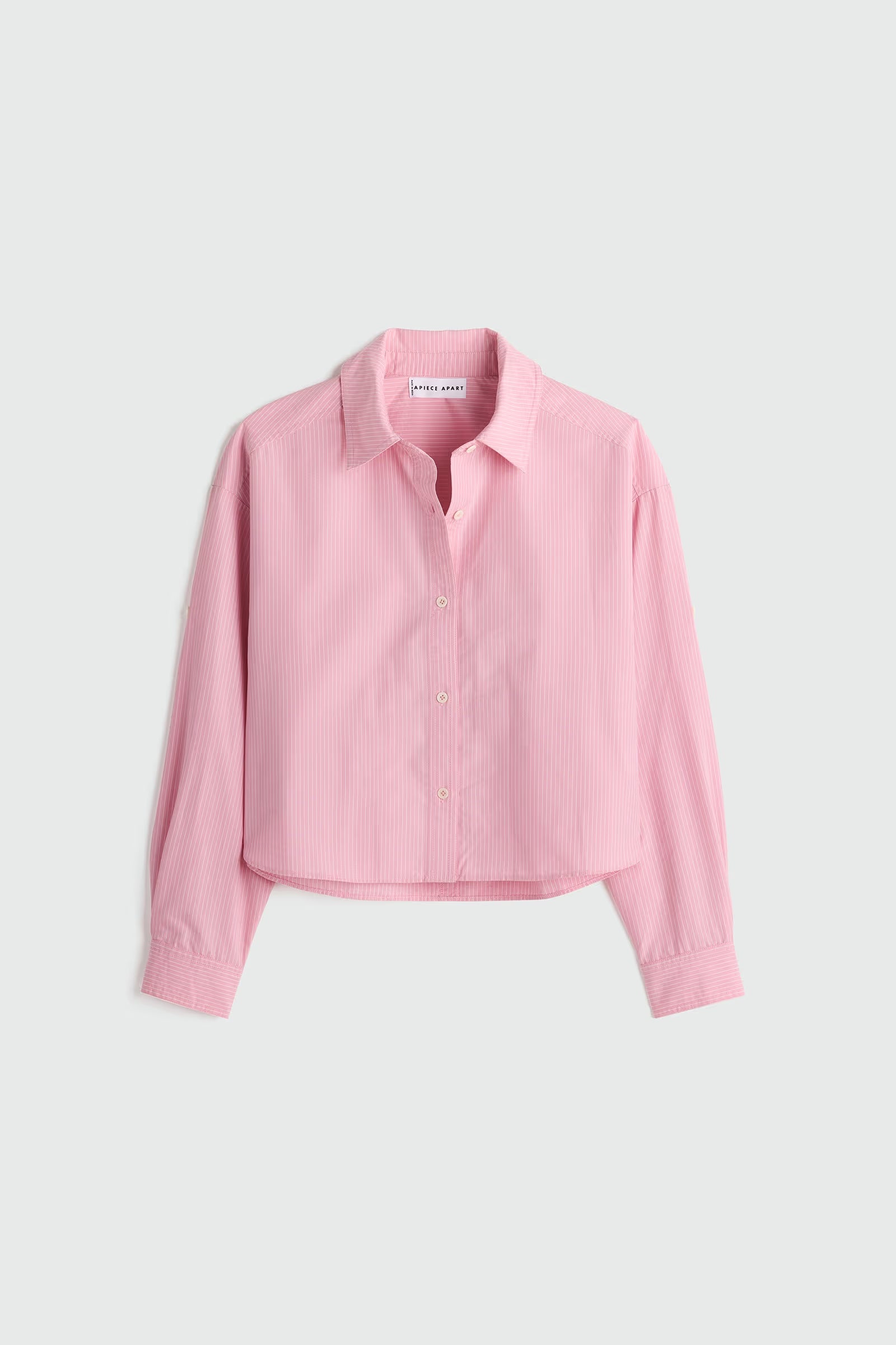 Pink shirt on a light gray background