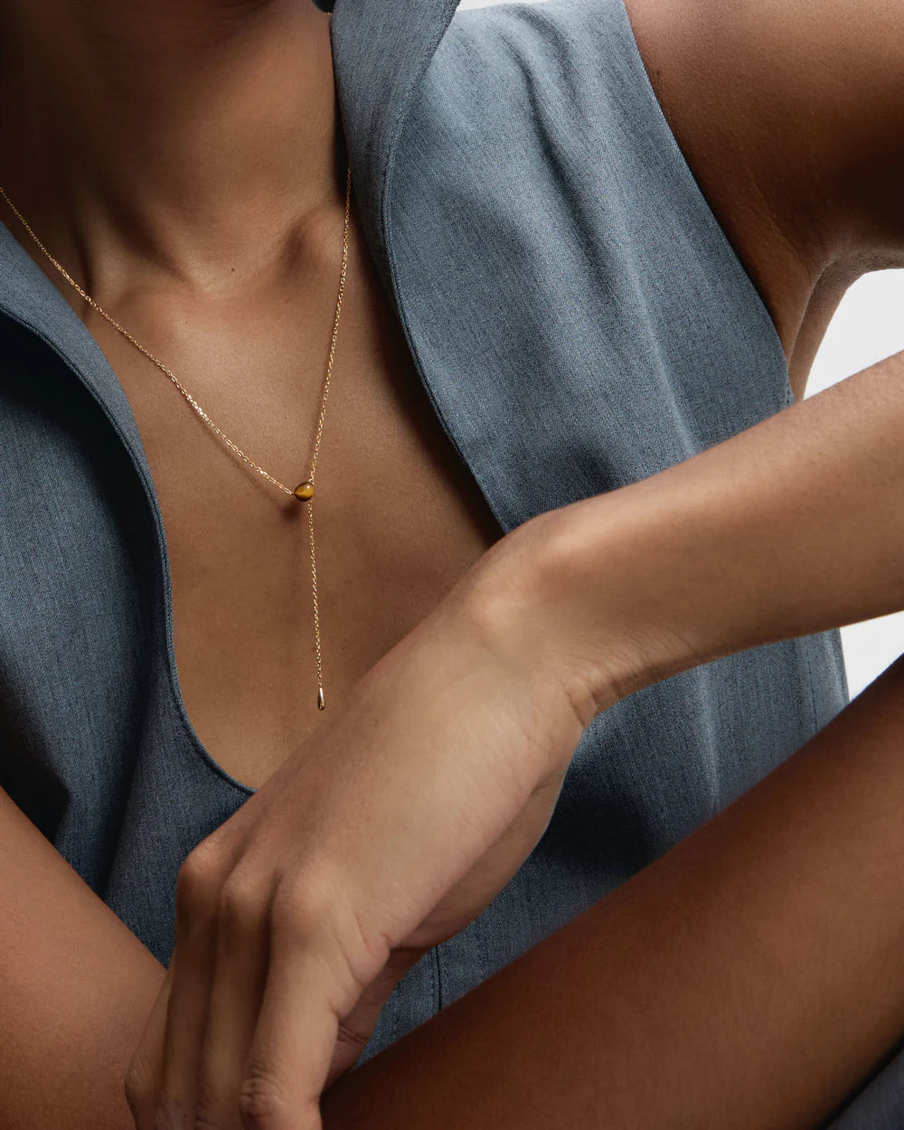 Tiger Eye Stella Necklace on model with blue top