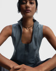 Woman wearing a sleeveless gray top and Rhodochrosite Luna Cord Necklace against a plain background