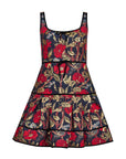 A sleeveless tiered dress with a red and gold floral print on a dark navy background, featuring a tie-neck detail and ruffled hem.