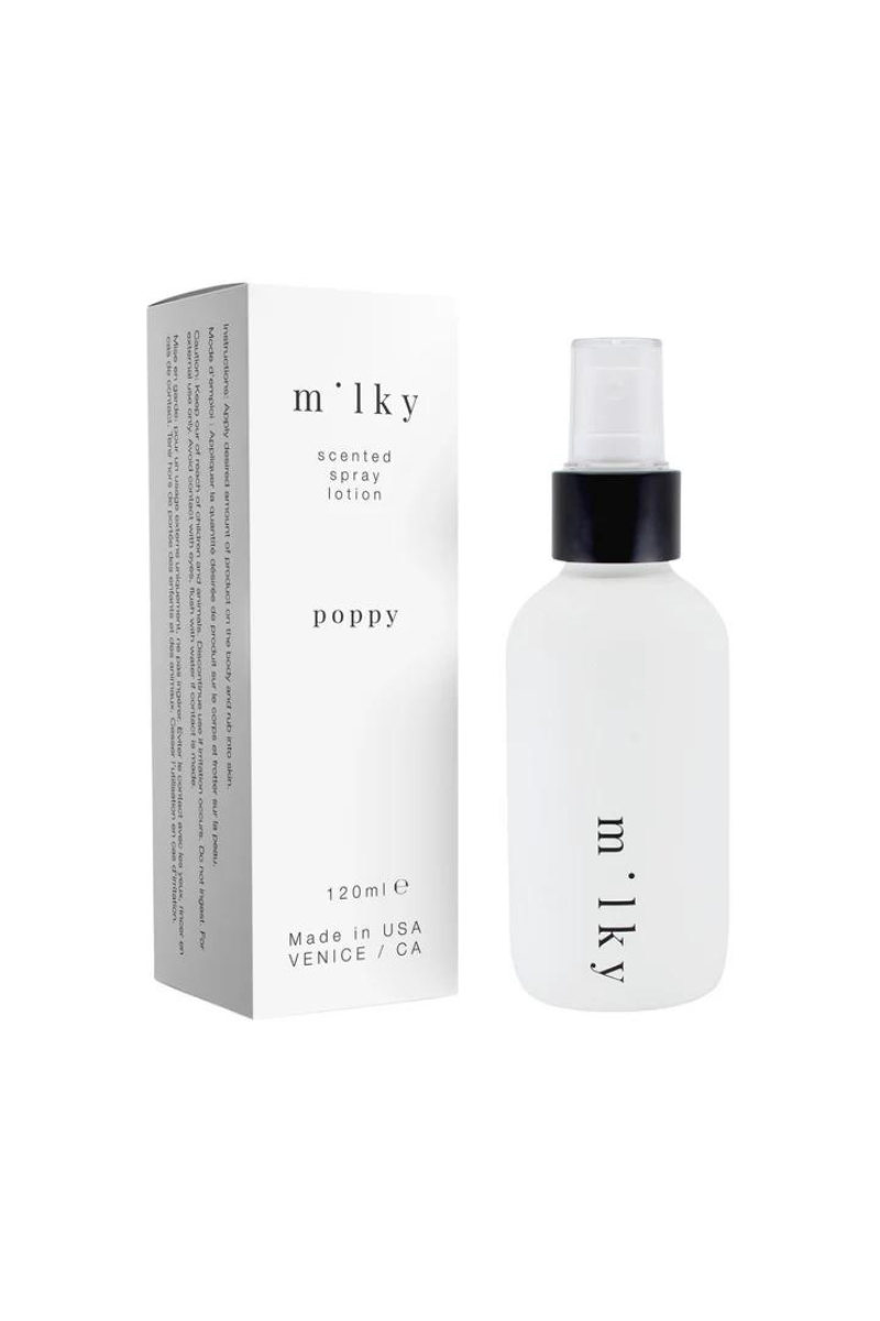 Riddle 4 oz Milky Spray Lotion Poppy next to box