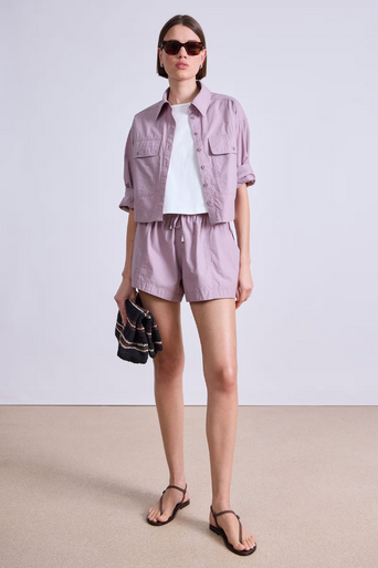 Apiece Apart Cropped Utility Shirt worn open, sleeve rolled up