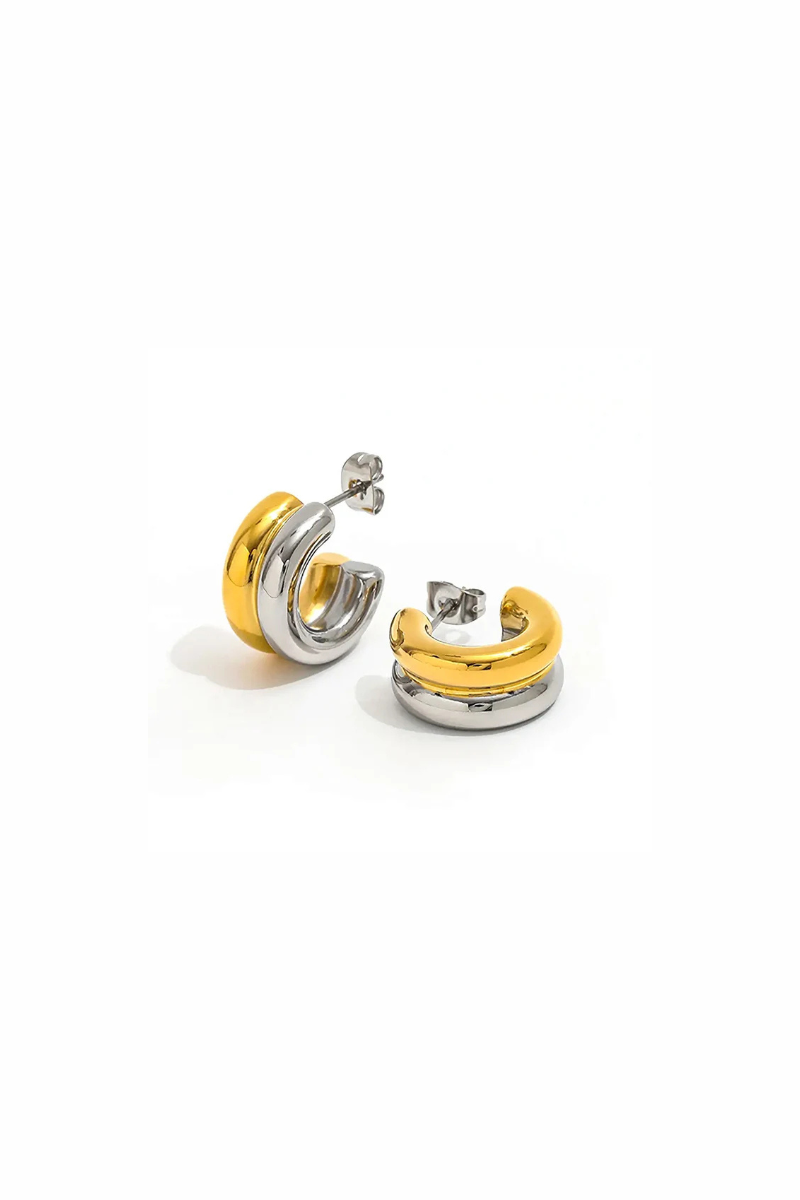 A pair of gold and silver hoop earrings with a polished finish, displayed on a clean white background.