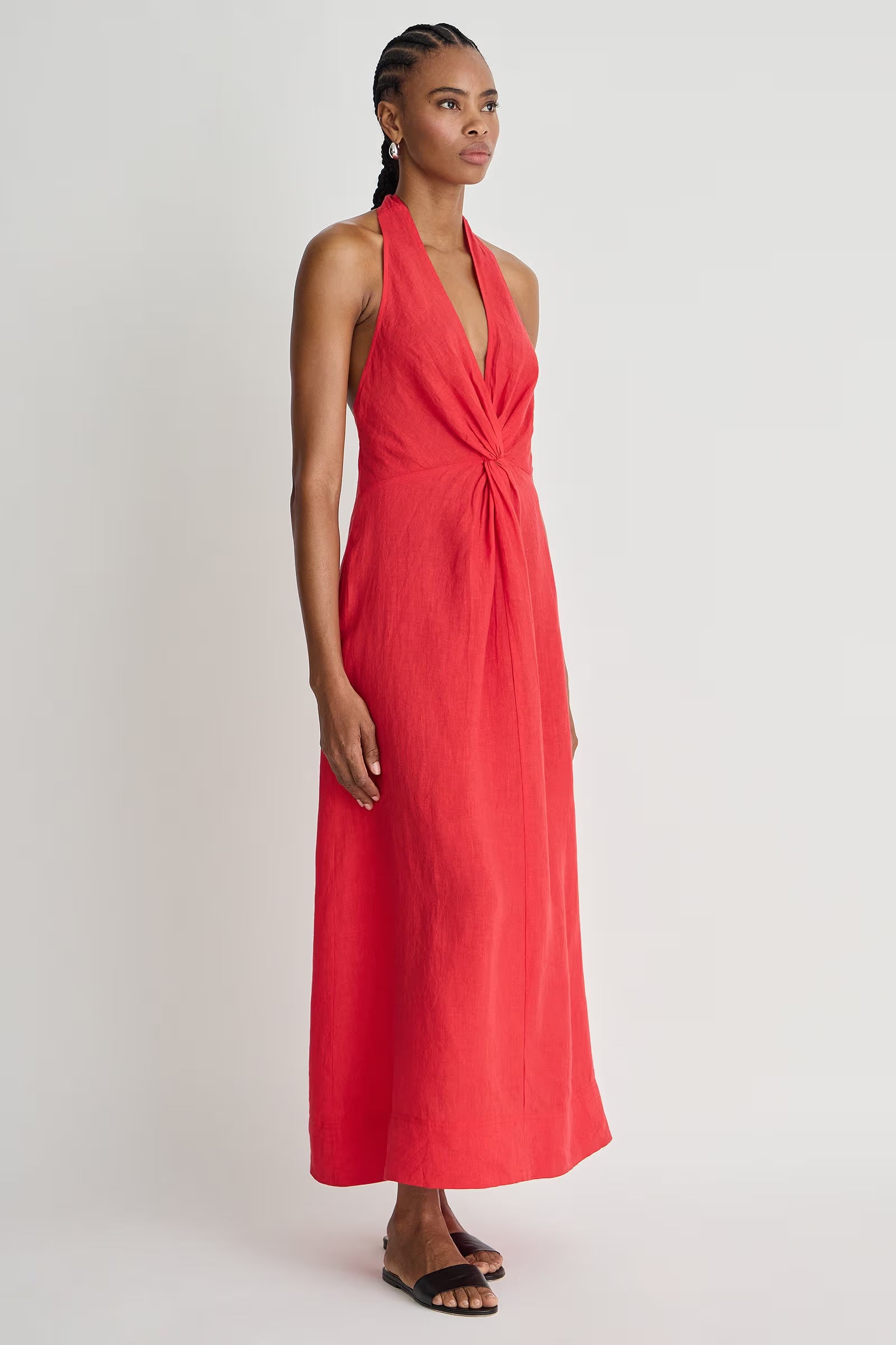Woman wearing a red dress on a white background