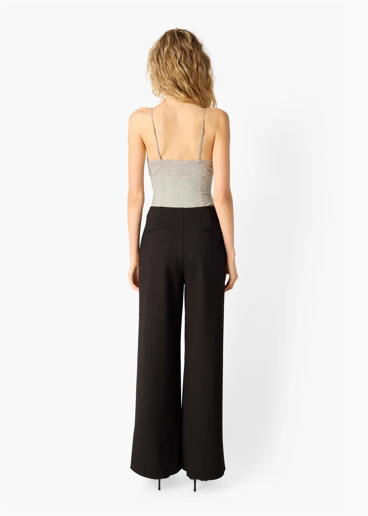 Amani Rib Knit Bodysuit with black pants, full body back